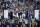 NEW ORLEANS, LOUISIANA - APRIL 04: Kansas Jayhawks players and coaches hold up the trophy after defeating the North Carolina Tar Heels 72-69 during the 2022 NCAA Men's Basketball Tournament National Championship at Caesars Superdome on April 04, 2022 in New Orleans, Louisiana. (Photo by Chris Graythen/Getty Images)