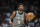 Brooklyn Nets guard Kyrie Irving (11) dribbles up court during the second half of an NBA basketball game against the Atlanta Hawks Saturday, April 2, 2022, in Atlanta. (AP Photo/Hakim Wright Sr.)