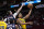 Indiana Pacers' Malcolm Brogdon (7) goes up for a shot as Houston Rockets' Garrison Mathews defend during the first half of an NBA basketball game Friday, March 18, 2022, in Houston. The Pacers won 121-118. (AP Photo/David J. Phillip)
