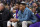 Los Angeles Lakers guards Russell Westbrook, front, and Malik Monk look on from the bench in the first half of an basketball game against the Denver Nuggets Sunday, April 10, 2022, in Denver. (AP Photo/David Zalubowski)