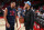 PORTLAND, OR - MARCH 30: Damian Lillard #0 of the Portland Trail Blazers and CJ McCollum #3 of the New Orleans Pelicans embrace before the game on March 30, 2022 at the Moda Center Arena in Portland, Oregon. NOTE TO USER: User expressly acknowledges and agrees that, by downloading and or using this photograph, user is consenting to the terms and conditions of the Getty Images License Agreement. Mandatory Copyright Notice: Copyright 2022 NBAE (Photo by Sam Forencich/NBAE via Getty Images)