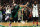 BOSTON, MASSACHUSETTS - APRIL 17: Jayson Tatum #0 of the Boston Celtics celebrates the game winning basket as Kyrie Irving #11 of the Brooklyn Nets looks on during the fourth quarter of Round 1 Game 1 of the 2022 NBA Eastern Conference Playoffs at TD Garden on April 17, 2022 in Boston, Massachusetts. The Celtics defeat the Nets 115-114.  (Photo by Maddie Meyer/Getty Images)