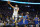 Golden State Warriors guard Stephen Curry (30) shoots against Denver Nuggets guard Bones Hyland, bottom, and forward Will Barton (5) during the second half of Game 2 of an NBA basketball first-round playoff series in San Francisco, Monday, April 18, 2022. (AP Photo/Jeff Chiu)