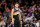 PHOENIX, ARIZONA - APRIL 19:  Devin Booker #1 of the Phoenix Suns looks on during the first half of Game Two of the Western Conference First Round NBA Playoffs at Footprint Center on April 19, 2022 in Phoenix, Arizona.  NOTE TO USER: User expressly acknowledges and agrees that, by downloading and or using this photograph, User is consenting to the terms and conditions of the Getty Images License Agreement. (Photo by Christian Petersen/Getty Images)