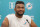 Miami Dolphins quarterback Tua Tagovailoa smiles during a news conference at the Dolphins NFL football training facility, Wednesday, April 20, 2022, in Miami Gardens, Fla. (AP Photo/Marta Lavandier)