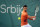 Novak Djokovic of Serbia returns a ball to Laslo Djere of Serbia during their tennis match of the Serbia Open tennis tournament in Belgrade, Serbia, Wednesday, April 20, 2022. (AP Photo/Darko Vojinovic)