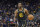 Golden State Warriors forward Andrew Wiggins brings the ball up against the Denver Nuggets during the second half of Game 1 of an NBA basketball first-round playoff series in San Francisco, Saturday, April 16, 2022. (AP Photo/Jeff Chiu)