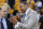 Mark Jackson, right, talks with Jeff Van Gundy before Game 4 of basketball's NBA Finals between the Golden State Warriors and the Toronto Raptors in Oakland, Calif., Friday, June 7, 2019. ABC/ESPN NBA analyst Jackson credits faith, confidence and longtime friendships with Van Gundy and Mike Breen as the main catalysts for his longevity and why he is working his 12th NBA Finals. (AP Photo/Tony Avelar)