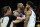 Referee David Guthrie (16) tries to separate Phoenix Suns center Bismack Biyombo, middle, and Dallas Mavericks forward Marquese Chriss, right, as Mavericks forward Sterling Brown, second from right, agrues during the second half of Game 5 of an NBA basketball second-round playoff series Tuesday, May 10, 2022, in Phoenix. The Suns won 110-80. (AP Photo/Ross D. Franklin)