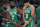 Milwaukee - May 7: The Celtics Jayson Tatum (right) heads for the sidelines holding his left wrist after appearing to hurt it on a first half slam dunk and subsequent fall to the floor. Teammate Jaylen Brown is at left.  The Boston Celtics visited the Milwaukee Bucks for Game Three of their NBA basketball Eastern Conference Semi-Final series at Fiserv Forum in Milwaukee, WI on May 7, 2022. (Photo by Jim Davis/The Boston Globe via Getty Images)