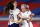 YOKOHAMA, JAPAN - JULY 30: Rose Lavelle #16, Alex Morgan #13, Christen Press #11 and Megan Rapinoe #15 of Team United States celebrate following their team's victory in the penalty shoot out after the Women's Quarter Final match between Netherlands and United States on day seven of the Tokyo 2020 Olympic Games at International Stadium Yokohama on July 30, 2021 in Yokohama, Kanagawa, Japan. (Photo by Laurence Griffiths/Getty Images)