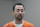 FILE - Dr. Larry Nassar, appears in court for a plea hearing on Nov. 22, 2017, in Lansing, Mich. More than 1,000 sexual abuse victims of a University of Michigan sports doctor would get a window in which they could sue the school for damages under bills that the Legislature will consider. Similar legislationwas enactedfollowing theconvictionof former women's national gymnastics team physician Larry Nassar, who molested hundreds of girls and women, including at Michigan State University. (AP Photo/Paul Sancya File)