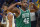 Boston - June 2: The Celtics Al Horford flexes to the crowd after Boston scored a late fourth quarter basket as they pulled away from Golden State for the victory. The Warriors Stephen Curry (30) looks dejected at left behind Horford. The Boston Celtics visited the Golden State Warriors for Game One of the NBA Finals at the Chase Center in San Francisco, CA on June 2, 2022. (Photo by Jim Davis/The Boston Globe via Getty Images)