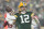 GREEN BAY, WISCONSIN - JANUARY 22:  Quarterback Aaron Rodgers #12 of the Green Bay Packers passes2 during the 4th quarter of the NFC Divisional Playoff game against the San Francisco 49ers at Lambeau Field on January 22, 2022 in Green Bay, Wisconsin. (Photo by Patrick McDermott/Getty Images)