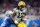 DETROIT, MICHIGAN - JANUARY 09: Davante Adams #17 of the Green Bay Packers carries the ball after a reception during the first half against the Detroit Lions at Ford Field on January 09, 2022 in Detroit, Michigan. (Photo by Rey Del Rio/Getty Images)