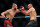 SINGAPORE, SINGAPORE - JUNE 12: Glover Teixeira of Brazil exchanges strikes with Jiri Prochazka of Czech Republic during their light Heavyweight Championship Fight at Singapore Indoor Stadium on June 12, 2022 in Singapore. (Photo by Yong Teck Lim/Getty Images)