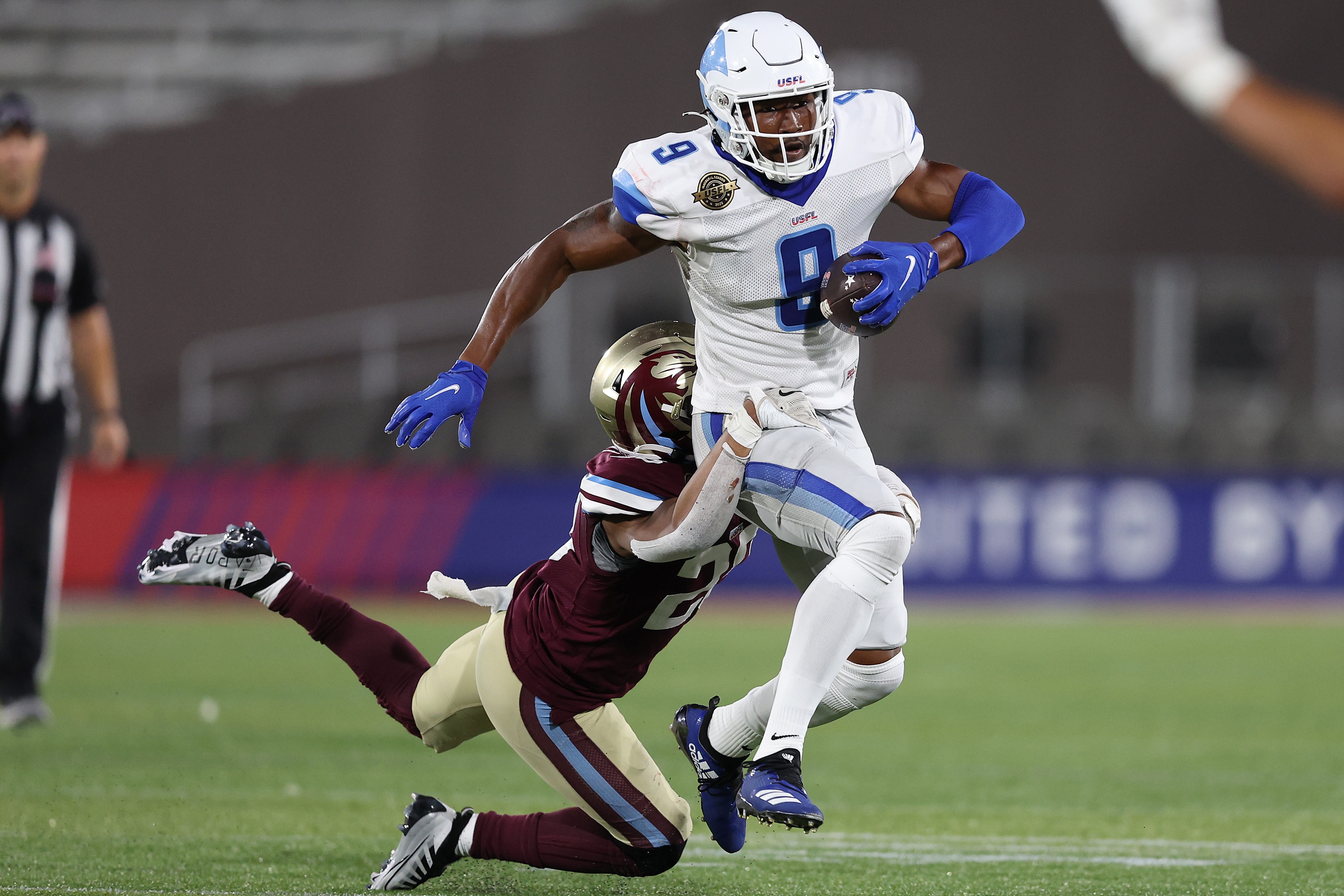 BIRMINGHAM, ALABAMA - MAY 28: Jonathan Adams #9 of the New Orleans Breakers is tackled by Jalin Burrell #23 of the Michigan Panthers in the fourth quarter of the game at Protective Stadium on May 28, 2022 in Birmingham, Alabama. (Photo by Patrick Smith/USFL/Getty Images)