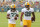 ASHWAUBENON, WISCONSIN - JULY 28:  Aaron jones #33 and AJ Dillon #28 of the Green Bay Packers works out during training camp at Ray Nitschke Field on July 28, 2021 in Ashwaubenon, Wisconsin. (Photo by Stacy Revere/Getty Images)