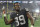 LAS VEGAS, NEVADA - JANUARY 09: Wide receiver Bryan Edwards #89 of the Las Vegas Raiders throws his gloves to fans as he walks off the field after the team's 35-32 overtime victory over the Los Angeles Chargers at Allegiant Stadium on January 9, 2022 in Las Vegas, Nevada. (Photo by Ethan Miller/Getty Images)