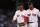 BOSTON, MASSACHUSETTS - JUNE 17: Rafael Devers #11 and Xander Bogaerts #2 of the Boston Red Sox walk off the field during the fourth inning against the St. Louis Cardinals at Fenway Park on June 17, 2022 in Boston, Massachusetts. (Photo by Paul Rutherford/Getty Images)