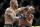 Alexander Volkanovski hits Max Holloway in a mixed martial arts featherweight championship bout at UFC 245, Saturday, Dec. 14, 2019, in Las Vegas. (AP Photo/John Locher)