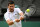Serbia's Novak Djokovic returns the ball to Italy's Jannik Sinner during their men's singles quarter final tennis match on the ninth day of the 2022 Wimbledon Championships at The All England Tennis Club in Wimbledon, southwest London, on July 5, 2022. - RESTRICTED TO EDITORIAL USE (Photo by SEBASTIEN BOZON / AFP) / RESTRICTED TO EDITORIAL USE (Photo by SEBASTIEN BOZON/AFP via Getty Images)