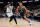 INDIANAPOLIS, INDIANA - FEBRUARY 27: Malcolm Brogdon #7 of the Indiana Pacers dribbles the ball while being guarded by Jaylen Brown #7 of the Boston Celtics in the third quarter at Gainbridge Fieldhouse on February 27, 2022 in Indianapolis, Indiana. NOTE TO USER: User expressly acknowledges and agrees that, by downloading and or using this Photograph, user is consenting to the terms and conditions of the Getty Images License Agreement. (Photo by Dylan Buell/Getty Images)