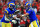 TAMPA, FLORIDA - JANUARY 23: Matthew Stafford #9 of the Los Angeles Rams hands the ball off to teammate Cam Akers #23in the fourth quarter of the game against the Tampa Bay Buccaneers in the NFC Divisional Playoff game at Raymond James Stadium on January 23, 2022 in Tampa, Florida. (Photo by Mike Ehrmann/Getty Images)