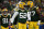 GREEN BAY, WISCONSIN - JANUARY 22:  Rashan Gary #52 of the Green Bay Packers is congratulated by nose tackle Kenny Clark #97 after making a sack during the first quarter of the NFC Divisional Playoff game against the San Francisco 49ers at Lambeau Field on January 22, 2022 in Green Bay, Wisconsin. (Photo by Quinn Harris/Getty Images)