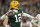 GREEN BAY, WISCONSIN - JANUARY 22:  Quarterback Aaron Rodgers #12 of the Green Bay Packers passes during the 1st quarter of the NFC Divisional Playoff game against the San Francisco 49ers at Lambeau Field on January 22, 2022 in Green Bay, Wisconsin. (Photo by Patrick McDermott/Getty Images)