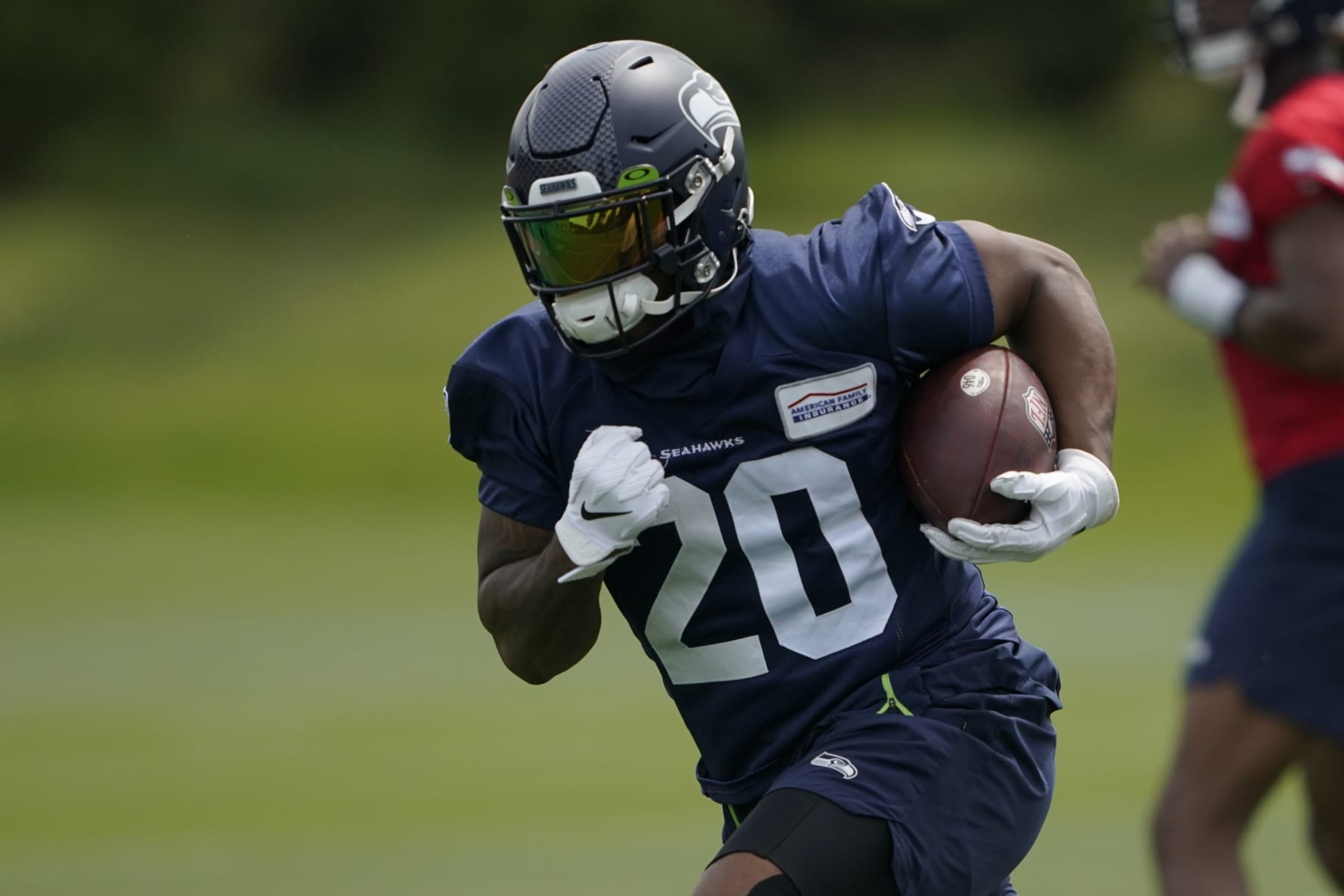 Seattle Seahawks running back Rashaad Penny runs a drill during NFL football practice Wednesday, June 8, 2022, in Renton, Wash. (AP Photo/Ted S. Warren)
