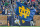 SOUTH BEND, IN - NOVEMBER 20: A Notre Dame Fighting Irish cheerleader runs onto the field with a Notre Dame Fighting Irish flag after a touchdown play during a game between the Notre Dame Fighting Irish and the Georgia Tech Yellow Jackets on November 20, 2021 at Notre Dame Stadium, in South Bend, IN.  (Photo by Robin Alam/Icon Sportswire via Getty Images)