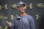 Baltimore Ravens head coach John Harbaugh answers questions from the media at the NFL football team's training camp in Owings Mills, Md., Wednesday, July 27, 2022. (AP Photo/Gail Burton)