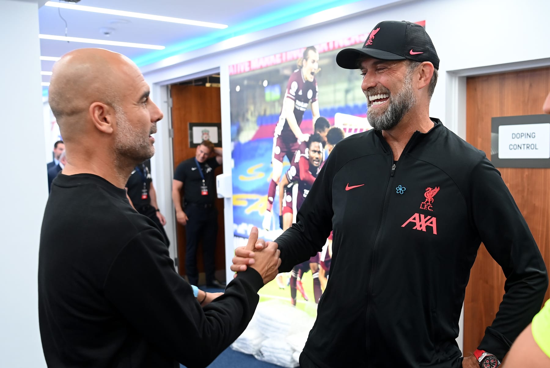 LEICESTER, ENGLAND - JULY 30: Pep Guardiola, Manager of Manchester City, shakes hands with Jurgen Klopp, Manager of Liverpool, as they meet Referee Craig Pawson prior to kick off of The FA Community Shield between Manchester City and Liverpool FC at The King Power Stadium on July 30, 2022 in Leicester, England. (Photo by Michael Regan - The FA/The FA via Getty Images)