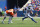 ORCHARD PARK, NY - AUGUST 20: James Cook #28 of the Buffalo Bills runs the ball asMichael Ojemudia #13 of the Denver Broncos looks to defend during the first half of a preseason game at Highmark Stadium on August 20, 2022 in Orchard Park, New York. (Photo by Timothy T Ludwig/Getty Images)