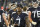 Tennessee Titans quarterback Malik Willis (7) watches from the sideline in the second half of a preseason NFL football game against the Tampa Bay Buccaneers Saturday, Aug. 20, 2022, in Nashville, Tenn. (AP Photo/John Amis)