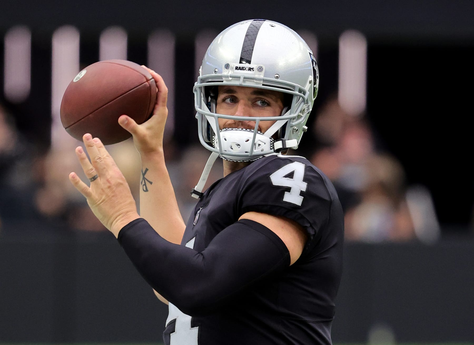 LAS VEGAS, NEVADA - AUGUST 14: Quarterback Derek Carr #4 of the Las Vegas Raiders throws during warmups before a preseason game against the Minnesota Vikings at Allegiant Stadium on August 14, 2022 in Las Vegas, Nevada. The Raiders defeated Vikings the 26-20. (Photo by Ethan Miller/Getty Images)