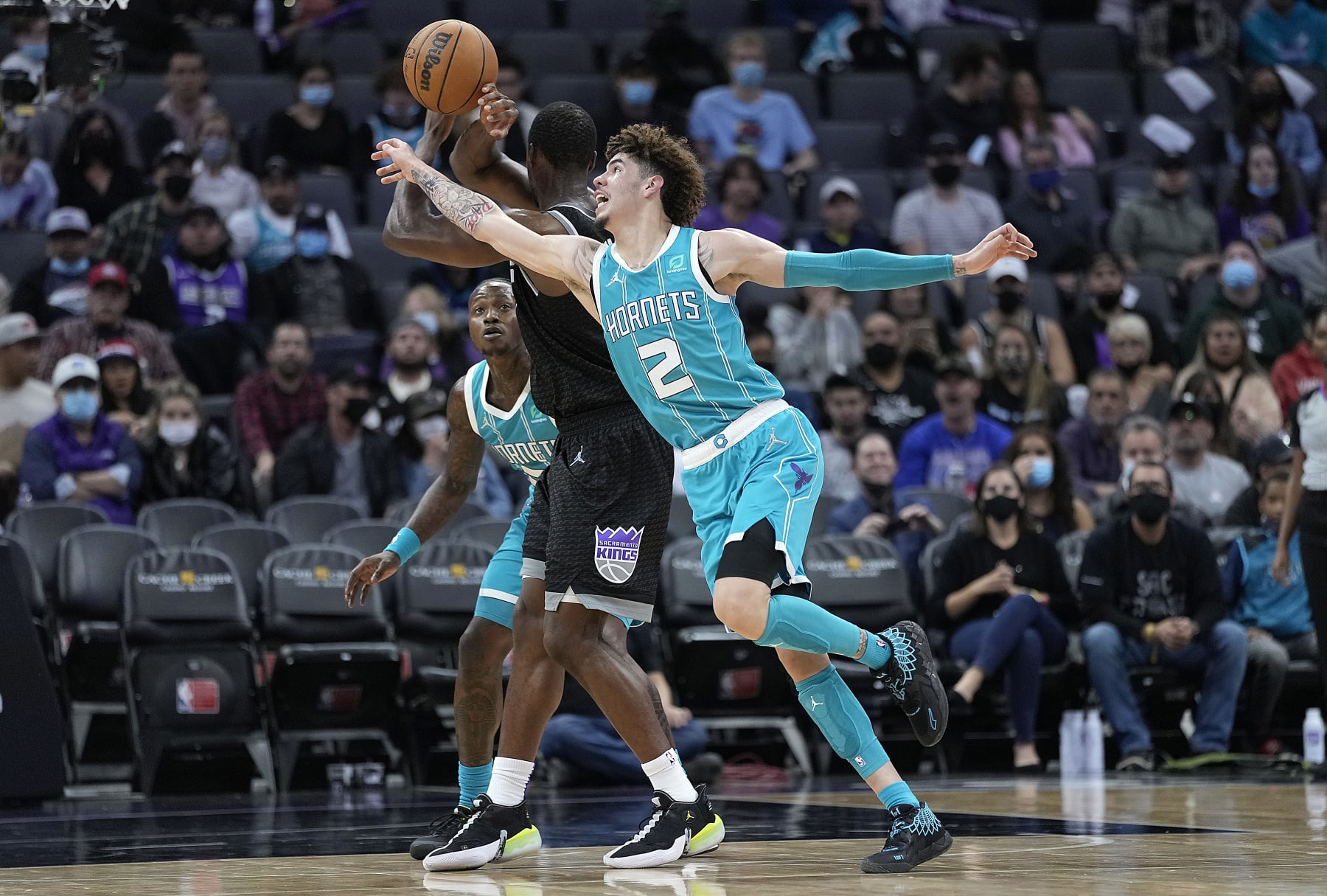 SACRAMENTO, CALIFORNIA - NOVEMBER 05: LaMelo Ball #2 of the Charlotte Hornets attempting to steal the ball fouls Harrison Barnes #40 of the Sacramento Kings during the third quarter at Golden 1 Center on November 05, 2021 in Sacramento, California. NOTE TO USER: User expressly acknowledges and agrees that, by downloading and or using this photograph, User is consenting to the terms and conditions of the Getty Images License Agreement. (Photo by Thearon W. Henderson/Getty Images)