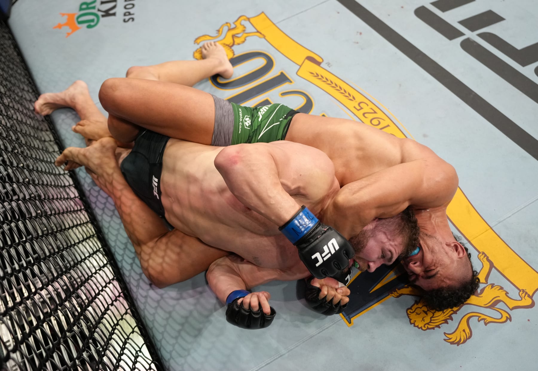 LAS VEGAS, NEVADA - SEPTEMBER 10: (R-L) Johnny Walker of Brazil secures a choke against Ion Cutelaba of Moldova in a heavyweight fight during the UFC 279 event at T-Mobile Arena on September 10, 2022 in Las Vegas, Nevada. (Photo by Jeff Bottari/Zuffa LLC)