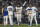 Seattle Mariners' Eugenio Suarez, center, celebrates with Luis Castillo, left, Taylor Trammell (20), Julio Rodriguez, second from right, and third base coach Manny Acta, right, after hitting a walkoff solo home run after a baseball game against the Atlanta Braves, Sunday, Sept. 11, 2022, in Seattle. (AP Photo/Stephen Brashear)