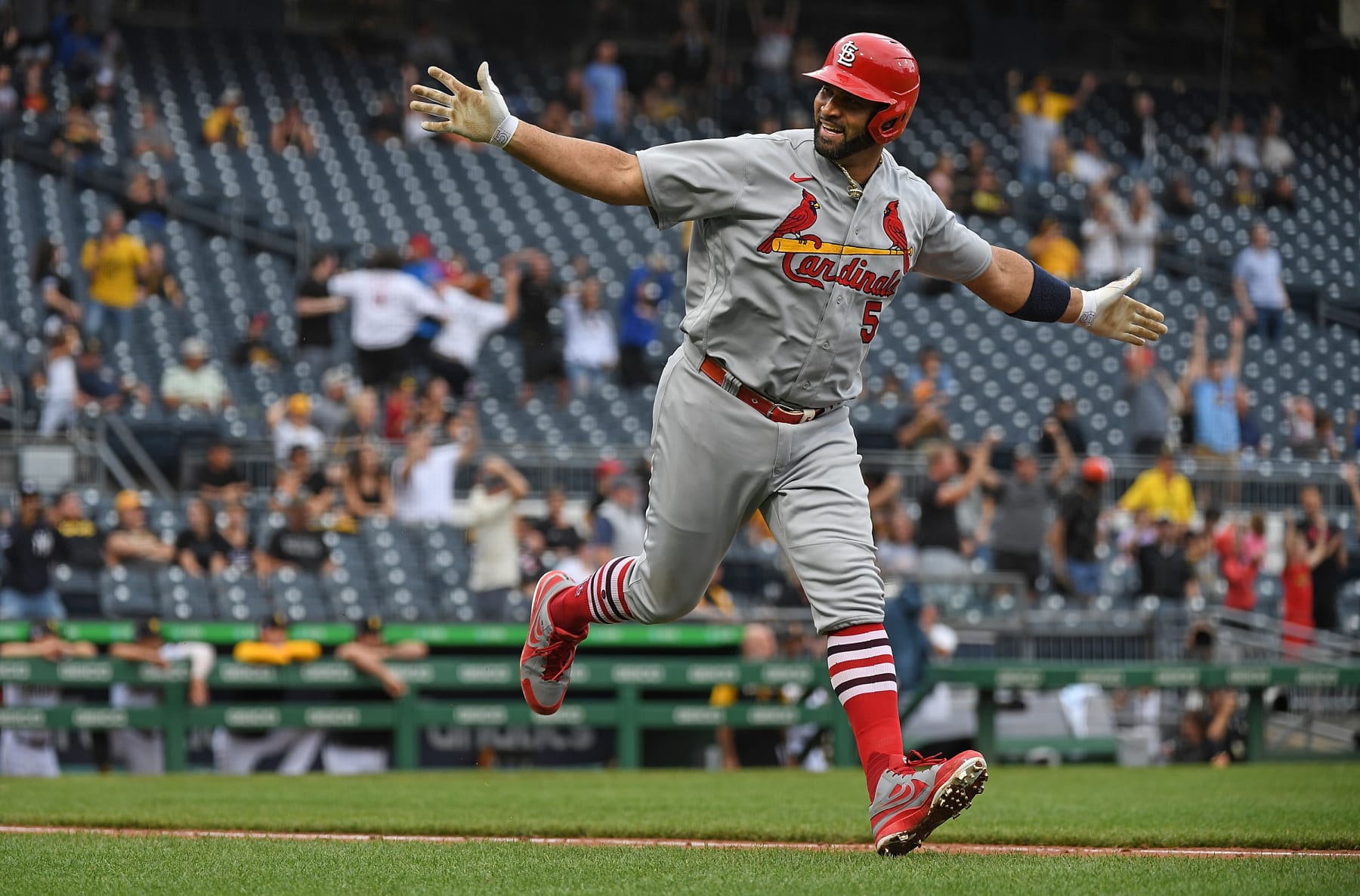PITTSBURGH, PA - SEPTEMBER 11: Albert Pujols #5 of the St. Louis Cardinals reacts as he rounds the bases after hitting a two-run home run in the ninth inning during the game against the Pittsburgh Pirates at PNC Park on September 11, 2022 in Pittsburgh, Pennsylvania. The home run was the 697th of Pujols career, moving him to 4th place all time in MLB home runs. (Photo by Justin Berl/Getty Images)