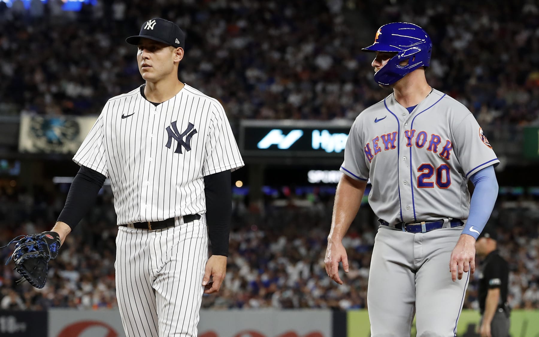 NEW YORK, NEW YORK - AUGUST 23: Pete Alonso #20 of the New York Mets in action against Anthony Rizzo #48 of the New York Yankees at Yankee Stadium on August 23, 2022 in New York City. The Yankees defeated the Mets 4-2. (Photo by Jim McIsaac/Getty Images)