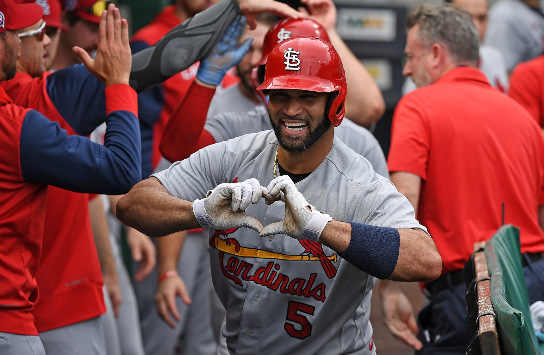 PITTSBURGH, PA - SEPTEMBER 11: Albert Pujols #5 of the St. Louis Cardinals reacts in the dugout after hitting a two run-home run in the ninth inning during the game against the Pittsburgh Pirates at PNC Park on September 11, 2022 in Pittsburgh, Pennsylvania. The home run was the 697th of Pujols career, moving him to 4th place all time in MLB home runs. (Photo by Justin Berl/Getty Images)
