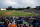 FILE - Spectators watch the bottom of the fourth inning of the Eastern League All-Star Double-A baseball game July 11, 2018, in Trenton, N.J. The Florida State League will limit defensive shifts by drawing chalk lines in a pie shape from second base to the outfield grass starting July 22, prohibiting infielders from the marked area pre-pitch in an experiment that could increase offense. Major League Baseball has been testing shift limits all season at Double-A and Class A, requiring teams to have four players on the infield, including two on each side of second base. (AP Photo/Julio Cortez, File)