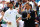 Swiss tennis player Roger Federer (R) and Serbia's Novak Djokovic take part in the Centre Court Centenary Ceremony, on the seventh day of the 2022 Wimbledon Championships at The All England Tennis Club in Wimbledon, southwest London, on July 3, 2022. - RESTRICTED TO EDITORIAL USE (Photo by Adrian DENNIS / AFP) / RESTRICTED TO EDITORIAL USE / The erroneous mention[s] appearing in the metadata of this photo by Adrian DENNIS has been modified in AFP systems in the following manner: [Swiss tennis player Roger Federer] instead of [Swiss former tennis player Roger Federer]. Please immediately remove the erroneous mention[s] from all your online services and delete it (them) from your servers. If you have been authorized by AFP to distribute it (them) to third parties, please ensure that the same actions are carried out by them. Failure to promptly comply with these instructions will entail liability on your part for any continued or post notification usage. Therefore we thank you very much for all your attention and prompt action. We are sorry for the inconvenience this notification may cause and remain at your disposal for any further information you may require. - RESTRICTED TO EDITORIAL USE (Photo by ADRIAN DENNIS/AFP via Getty Images)