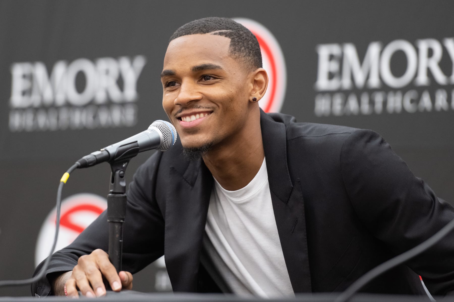 ATLANTA, GA - JULY 1: Dejounte Murray of the Atlanta Hawks talks to the media during the introductory draft press conference on July 1, 2022 at State Farm Arena in Atlanta, Georgia. NOTE TO USER: User expressly acknowledges and agrees that, by downloading and/or using this Photograph, user is consenting to the terms and conditions of the Getty Images License Agreement. Mandatory Copyright Notice: Copyright 2022 NBAE (Photo by Adam Hagy/NBAE via Getty Images)