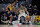 INDIANAPOLIS, INDIANA - JANUARY 12: Jayson Tatum #0 of the Boston Celtics dribbles the ball while being guarded by Malcolm Brogdon #7 of the Indiana Pacers in the first quarter at Gainbridge Fieldhouse on January 12, 2022 in Indianapolis, Indiana. NOTE TO USER: User expressly acknowledges and agrees that, by downloading and or using this Photograph, user is consenting to the terms and conditions of the Getty Images License Agreement. (Photo by Dylan Buell/Getty Images)