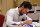 LAS VEGAS, NEVADA - SEPTEMBER 15: Dylan Larkin of the Detroit Red Wings signs autographs during the 2022 NHL Players Media Tour at Encore Las Vegas on September 15, 2022 in Las Vegas, Nevada. (Photo by Ethan Miller/Getty Images)