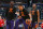 NEW ORLEANS, LA - MARCH 15: Deandre Ayton #22 of the Phoenix Suns, Devin Booker #1 of the Phoenix Suns and Mikal Bridges #25 of the Phoenix Suns warm up before the game against the New Orleans Pelicans on March 15, 2022 at the Smoothie King Center in New Orleans, Louisiana. NOTE TO USER: User expressly acknowledges and agrees that, by downloading and or using this Photograph, user is consenting to the terms and conditions of the Getty Images License Agreement. Mandatory Copyright Notice: Copyright 2022 NBAE (Photo by Layne Murdoch Jr./NBAE via Getty Images)