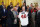 US President Joe Biden is presented an Atrlanta Braves jersey in the East Room of the White House in Washington, DC, on September 26, 2022, as he hosts a celebration for the Braves following their 2021 World Series championship. On right is Braves chairman Terry McGuirk. (Photo by Mandel NGAN / AFP) (Photo by MANDEL NGAN/AFP via Getty Images)